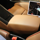How to leave your phone hidden while charging, as illustrated in a Porsche 918 Spyder.